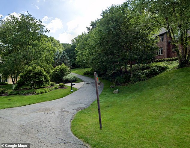 According to police, Rosenberg had invited Moore-Rouse to his home, then shot his friend in the back of the head, dragged his body down the driveway and hid it off the road.  In the photo: a path leading to the Rosenberg house.