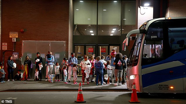 Dozens of immigrant families are seen arriving from Texas at the Port Authority bus terminal early on September 6, 2023.