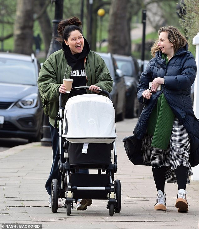 The singer, best known for her hits Pack Up and Skinny Jeans, was seen pushing her baby in a pram while chatting with her friend Helen.