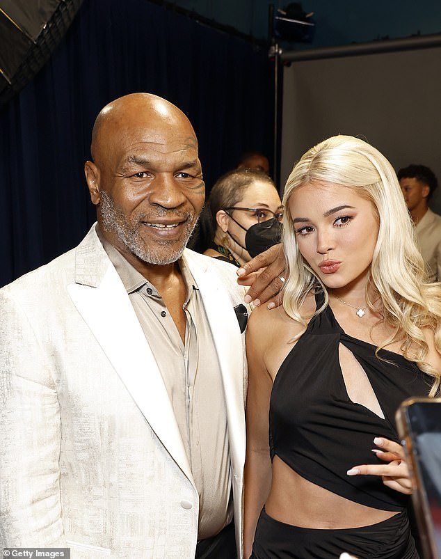 He has become a celebrity in his own right after amassing millions of followers on social media (pictured with Mike Tyson at the ESPY Sports Awards in Hollywood in 2023).