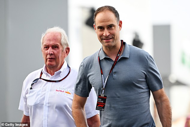 Helmut Marko has revealed that he will not be leaving Red Bull after speaking with the company's sporting director Oliver Mintzlaff (right).