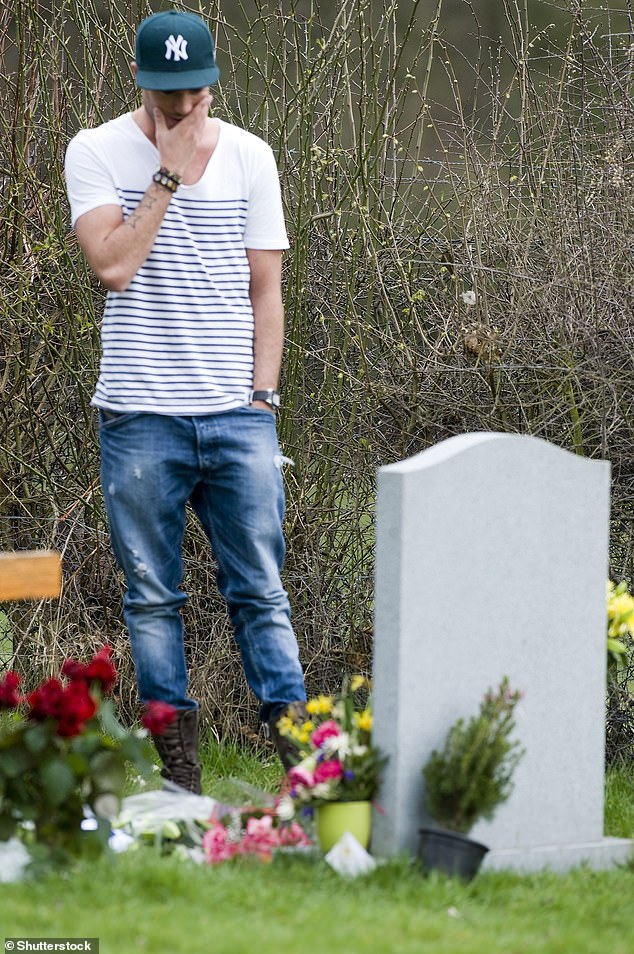After Jade's death two years later, he suffered severe depression and turned to alcohol (pictured visiting Jade's grave in 2011).
