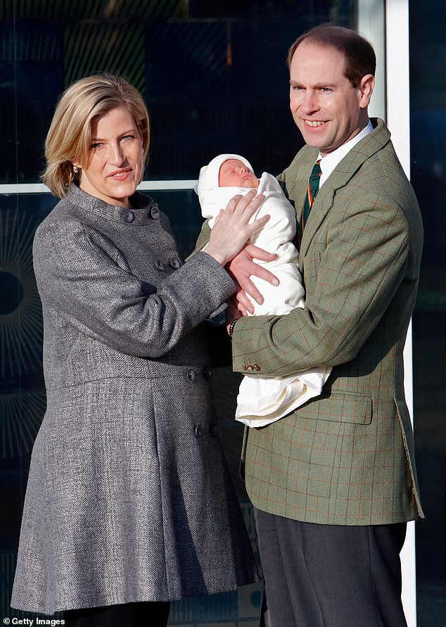 Sophie and Prince Edward are pictured holding their new son James in December 2007.