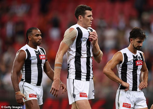 Overwhelmed by a speeding orange tsunami, the Magpies were denied the perfect start to their premiership defence.