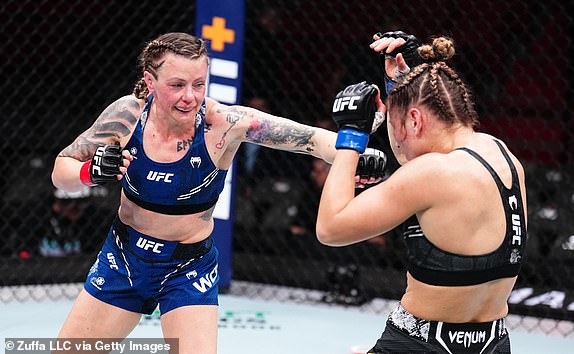 MIAMI, FLORIDA – MARCH 9: (L-R) Joanne Wood of Scotland punches Maryna Moroz of Ukraine in a flyweight bout during the UFC 299 event at Kaseya Center on March 9, 2024 in Miami, Florida. (Photo by Chris Unger/Zuffa LLC via Getty Images)