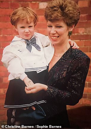 Christine holding Sophie at her baptism in 1991