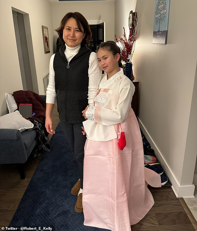 In another image, Marion can be seen wearing a pink and white hanbok while posing with her mother Jung-a.