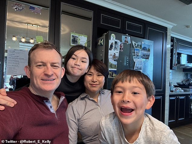 Professor Kelly takes a selfie with his wife Jung-a and children Marion and James