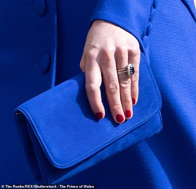 She usually wears her wedding ring and an engagement ring, which previously belonged to Princess Diana. Featuring a 12-carat oval Ceylon sapphire surrounded by a cluster of 14 solitaire diamonds set in white gold, Princess Diana chose the ring when the then Crown Jewelers, Garrard of Mayfair, presented her with a selection of options on her engagement to Prince Charles.