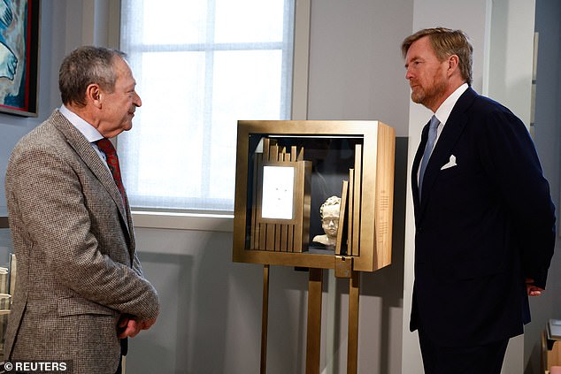 Dutch King Willem Alexander is given a tour of the National Holocaust Museum in Amsterdam