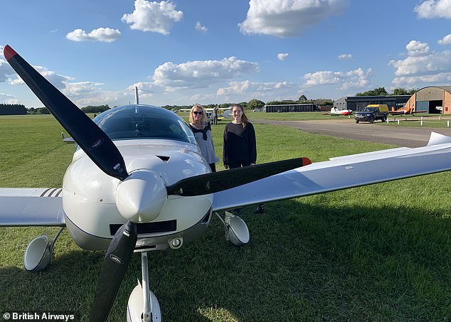 Teresa (left) and Ella (right) photographed with a light aircraft at White Waltham airfield in 2019, the day before Ella's interview for flight training.