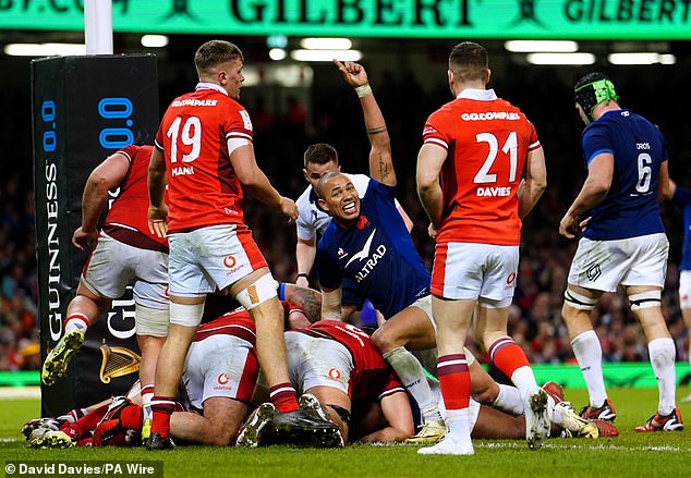 Georges-Henri Colombe crosses the line in Cardiff as France score their third try of the match