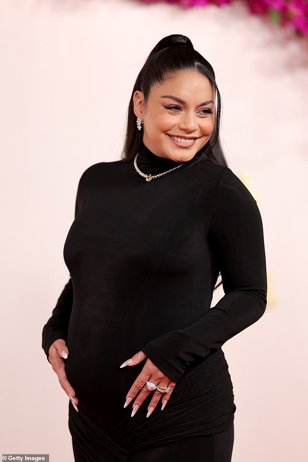 The star, who is married to Cole Tucker, showed off her pregnant belly in a clingy black dress
