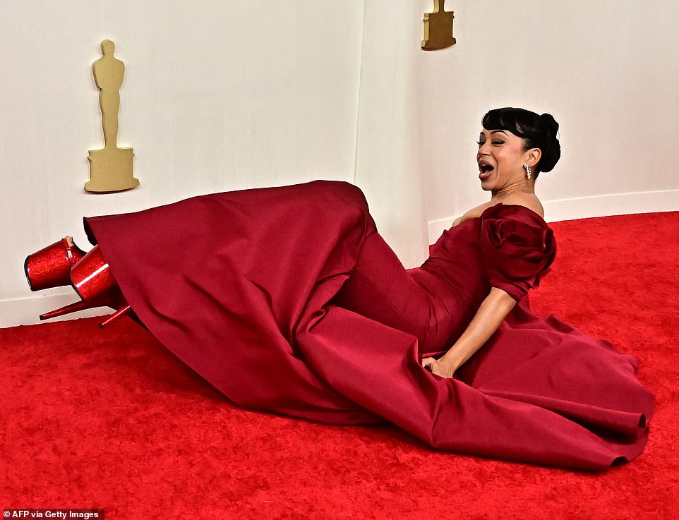 YouTube star Liza Koshy's dress was absolutely stunning - but the insanely high heels she chose to wear with it led to red carpet disaster as she toppled in front of the cameras