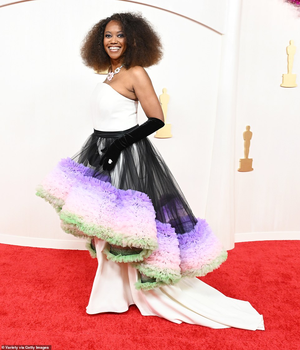 The 54-year-old turned heads for all the wrong reasons thanks to the garish tulle accessory, which puffed out behind her as she made her way down the red carpet