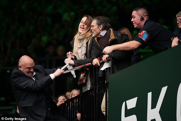 : Protesters are challenged by security during Crufts 2024 at the NEC Arena
