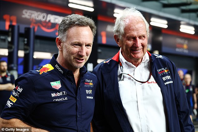 Dr Helmut Marko (right) said suspension was now ruled out after talks with the sports director of the energy drinks company.