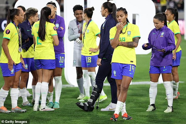 Brazilian players look dejected after receiving their silver medal, despite having more shots