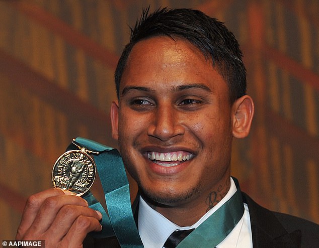 The Dally M winner as the sport's best player (pictured with his medal in 2012) says his daughters saved him from suicide more than once.