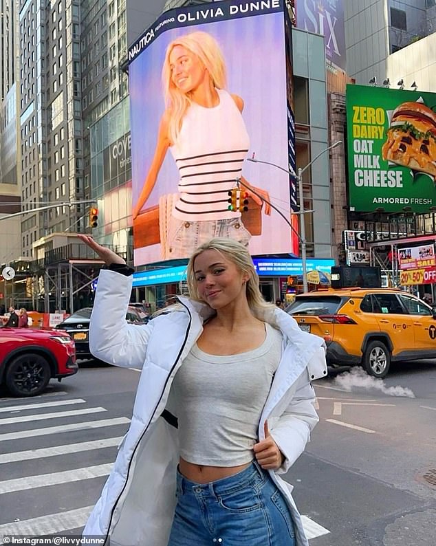 Dunne was in New York late last month on a layover after a track and field meet in Florida - and shared photos of himself in front of his Times Square billboard