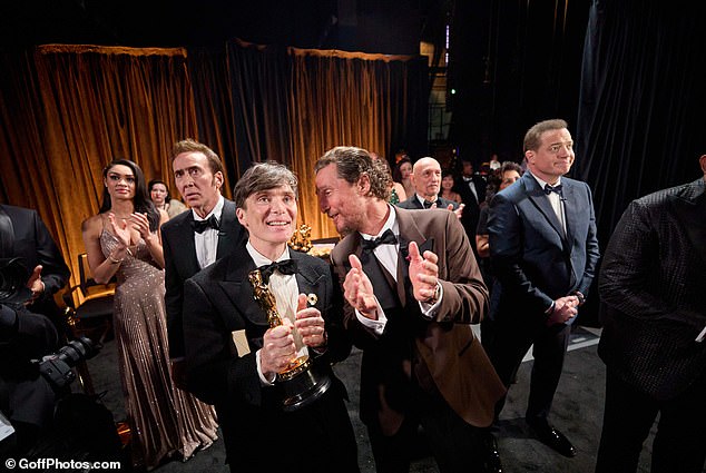 Cillian Murphy was seen applauding backstage with his best actor gong alongside presenters Nicholas Cage, Matthew McConaughey, Sir Ben Kingsley and Brendan Fraser