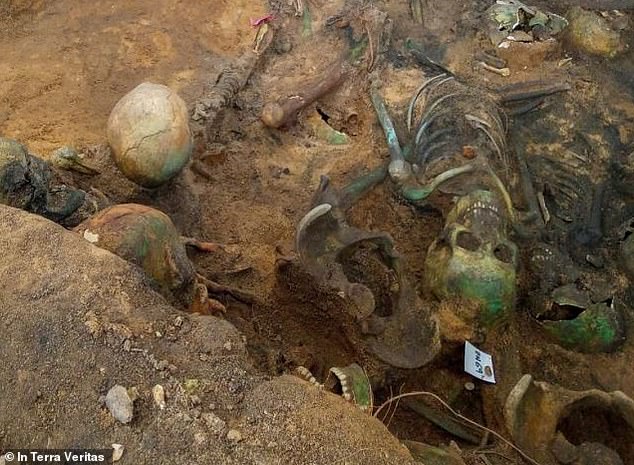 Some skeletons are green due to waste from a neighboring copper factory being disposed of on site, just as copper jewelry turns green.