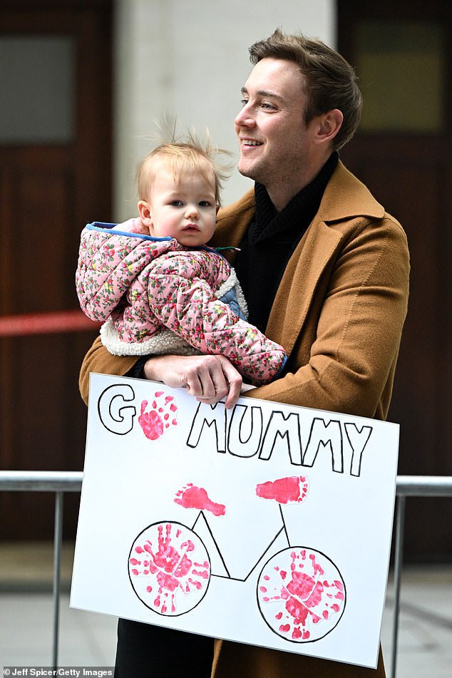 Former England cricketer Stuart and Annabella were seen holding onto a sign that read 'Go Mummy'