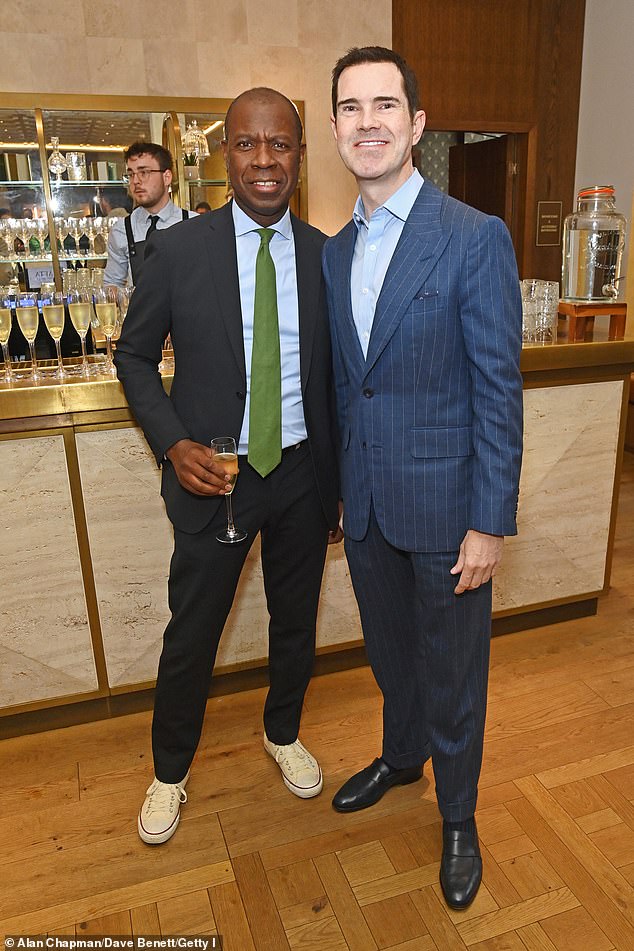 Journalist Clive Myrie looked sharp in a suit as he posed with Jimmy in the bar