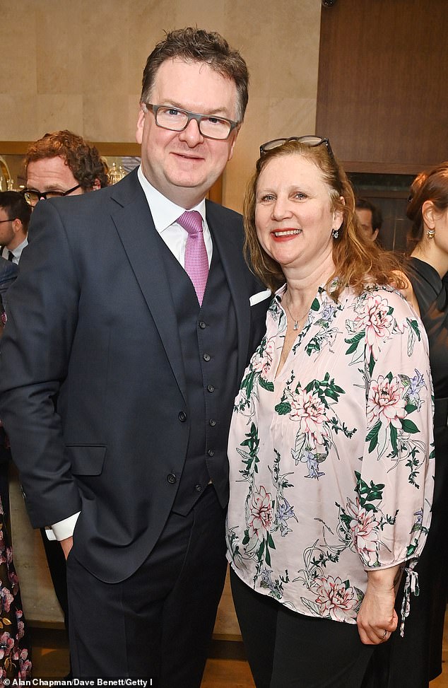 Angela later posed with former CEO of Fortnum & Mason Ewan Venters