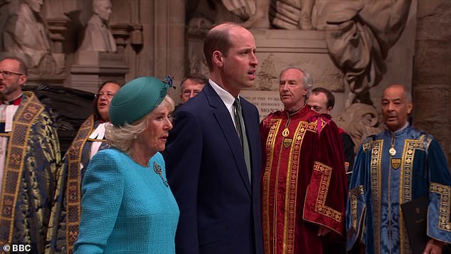 William and Camilla are pictured walking through Westminster Abbey
