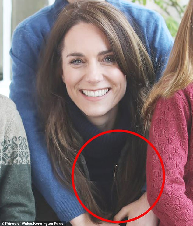 Kate's zipper appears to be misaligned in the photo as the top of it is further to the left and appears significantly lighter than the rest of the zipper