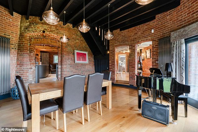The mill's dining room has exposed brick walls and enough space for a baby grand piano.