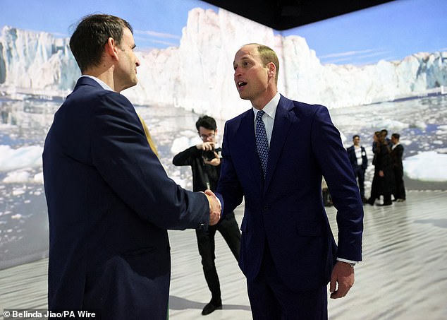 The Prince of Wales speaks to an attendee at the inaugural Earthshot+ event today