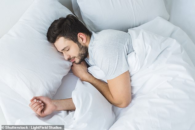 A bracelet that vibrates during sleep could stop people grinding their teeth. The gadget is wirelessly connected to a mouthguard packed with pressure sensors (stock image)