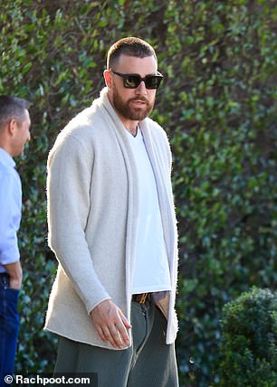 The NFL star wore a cream cardigan to the casual lunch, the day after attending an Oscars after-party