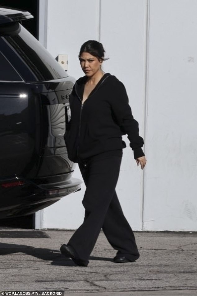 The 44-year-old reality TV star looked cozy in a black zip-up hoodie and a pair of matching oversized sweatpants as she was pictured leaving a studio