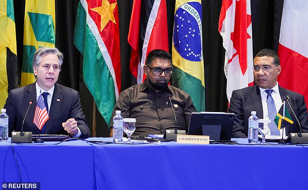 His resignation was quickly confirmed by Guyana's President Mohamed Irfaan Ali, the current chairman of the Caribbean Community (CARICOM).  He is seen flanked by US Secretary of State Antony Blinken and Jamaican Prime Minister Andrew Holness