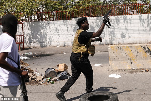 The coalition called the emergency meeting as gangs across the Caribbean country continue to unite and blow up government buildings and foreign embassies.  The leader of the alliance of gangs, former police officer Jimmy 'Barbecue' Cherizier, is seen in Port-au-Prince on Monday