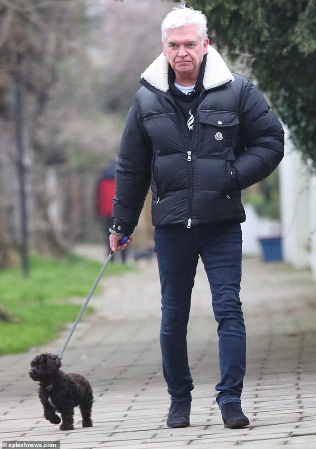 1710228089 256 Shamed This Morning presenter Phillip Schofield looks sombre while walking