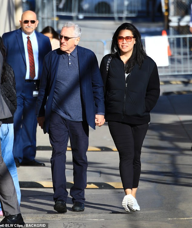 The Godfather star ¿ who welcomed daughter Gia Virginia with Chen last year ¿ cut a sharp figure in a navy shirt and blazer teamed with matching trousers