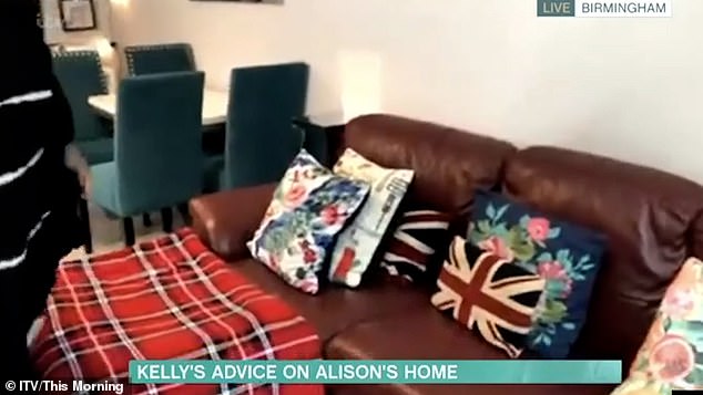 The star showed off her sumptuous leather sofas, which she adorned with the Union Jack and floral cushions