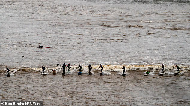 Every year, enthusiasts flock to the river in an attempt to surf the wave while thousands of spectators watch.