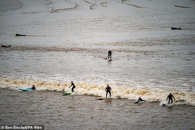 1710249018 847 Moment huge line of surfers ride the five star Severn Bore
