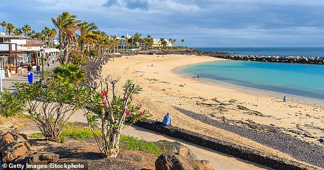 Playa Flamingo in the holiday village of Playa Blanca on the coast of the island of Lanzarote, Spain. stock image
