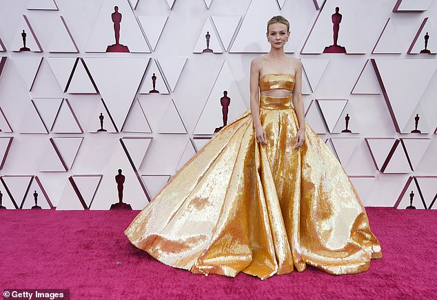 This year's Oscars was in stark contrast to the 2021 ceremony - the last Oscars red carpet she walked - with Covid restrictions meaning she could only bring her husband Marcus Mumford.  She was nominated for Best Actress once again for her role in Promising Young Woman;  seen in April 2021