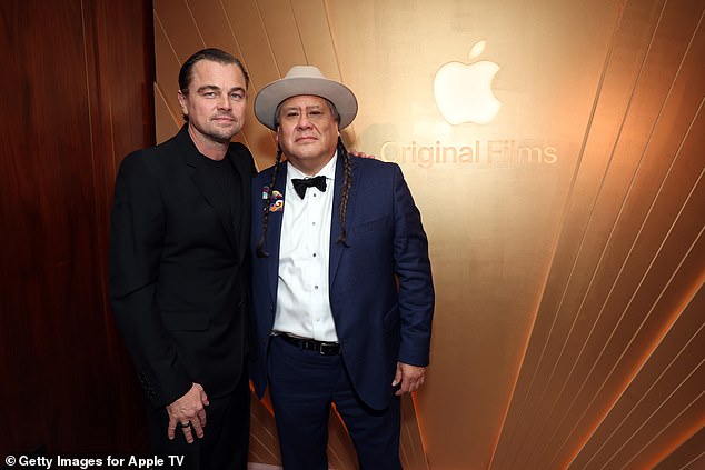 Leo is pictured with Killers of the Flower Moon co-star Yancey Red Corn at the Apple Original Films Oscar celebration on Sunday