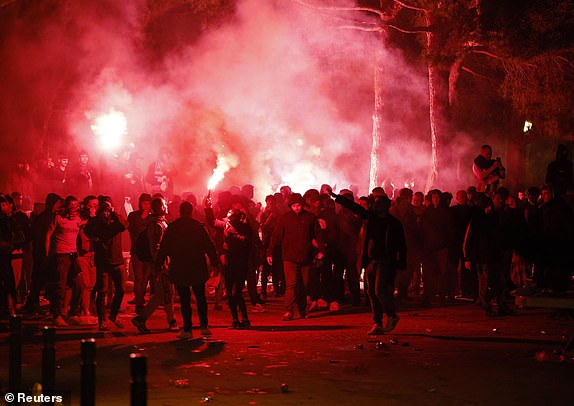 Soccer Football - Champions League - Round of 16 - Second Leg - FC Barcelona v Napoli - Estadi Olimpic Lluis Companys, Barcelona, ​​Spain - March 12, 2024 Fans with flares are seen outside the stadium before the match REUTERS/Albert Gea