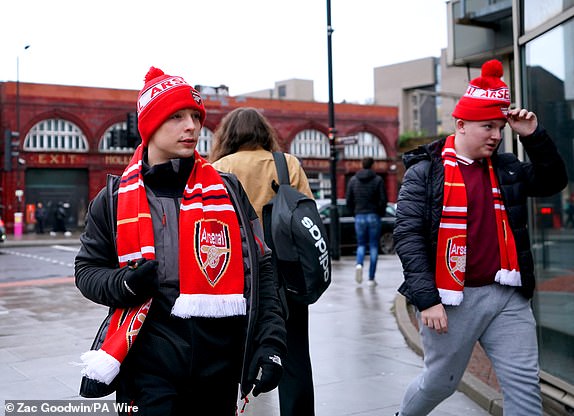 Arsenal fans make their way to the stadium before the second leg of their UEFA Champions League round of 16 match at the Emirates Stadium, London. Photo date: Tuesday March 12, 2024. PA Photo. See PA story SOCCER Arsenal. Photo credit should read: Zac Goodwin/PA Wire.RESTRICTIONS: Use subject to restrictions. Editorial use only, no commercial use without prior consent of the rights holder.