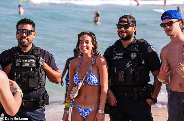 Police officers were happy to pose with spring breakers on Fort Lauderdale Beach