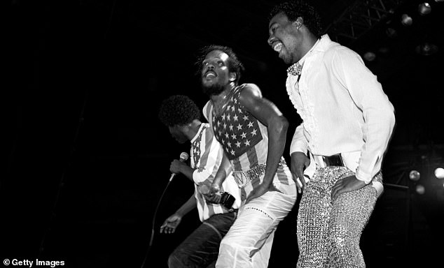 Singers and musicians Ronnie and Charlie Wilson of The Gap Band and Anthony 'Baby Gap' Walker performing at the UIC Pavilion in Chicago, Illinois in January 1983